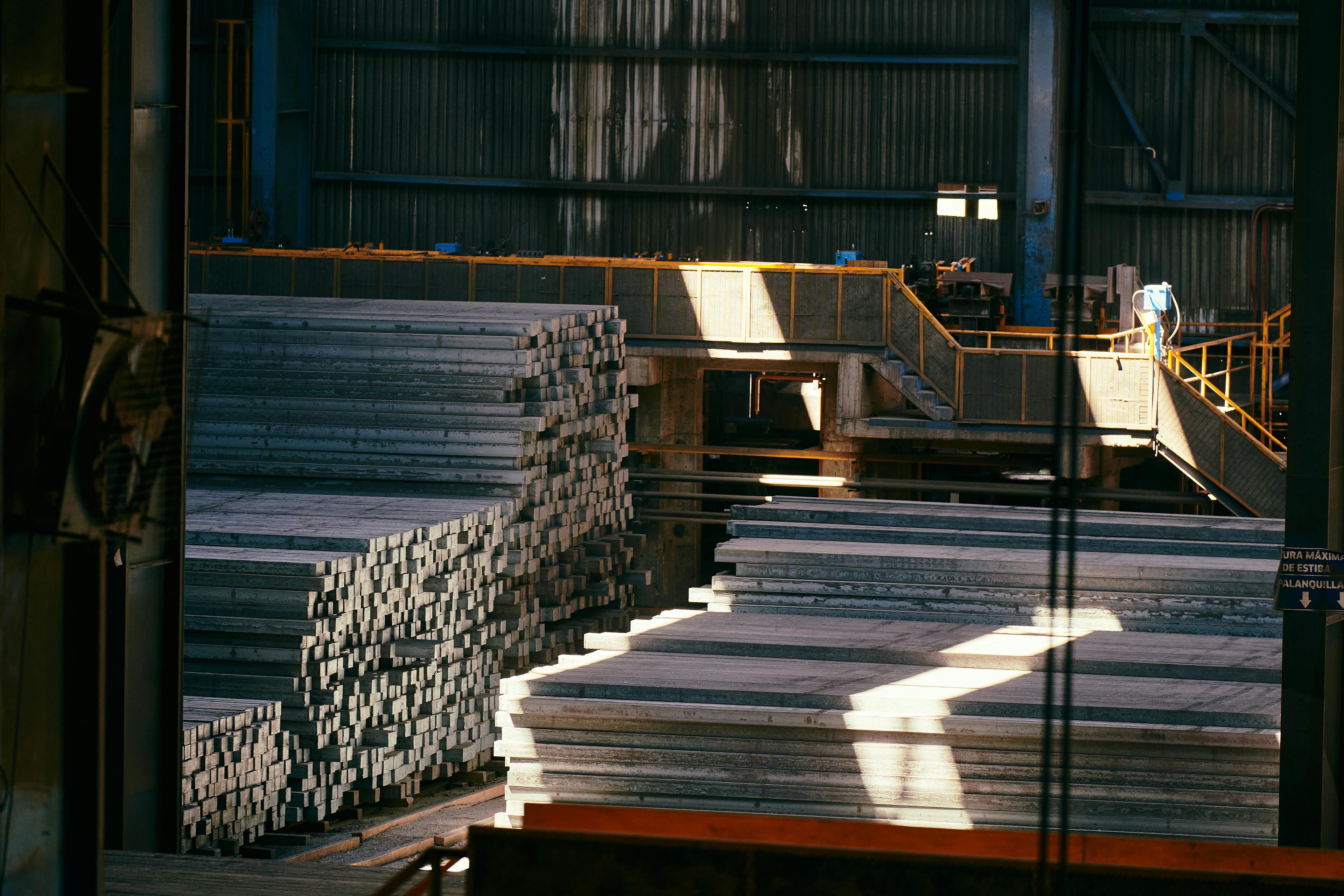 Stacked steel inventory inside the Siva Sakthi Steel warehouse